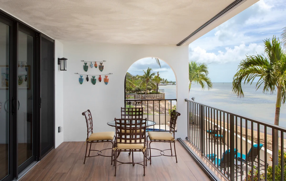 Custom outdoor living area with balcony overlooking Key West beaches