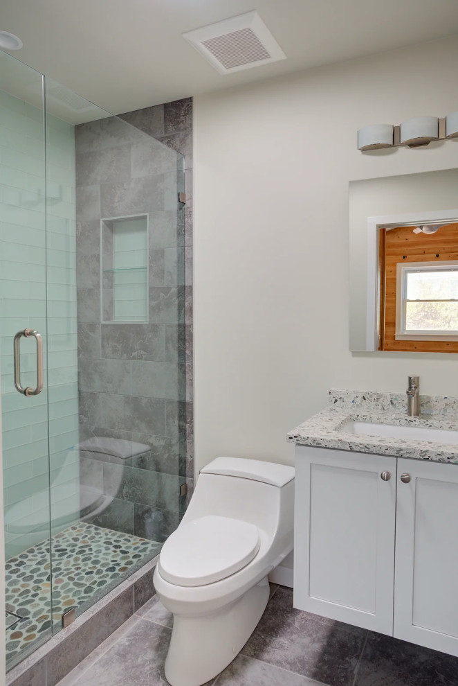 Clean and modern bathroom with large glass shower featuring elegant fixtures in Key West