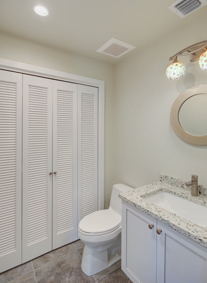 Luxurious Key West bathroom renovation featuring minimalist design with neutral tones and custom vanity