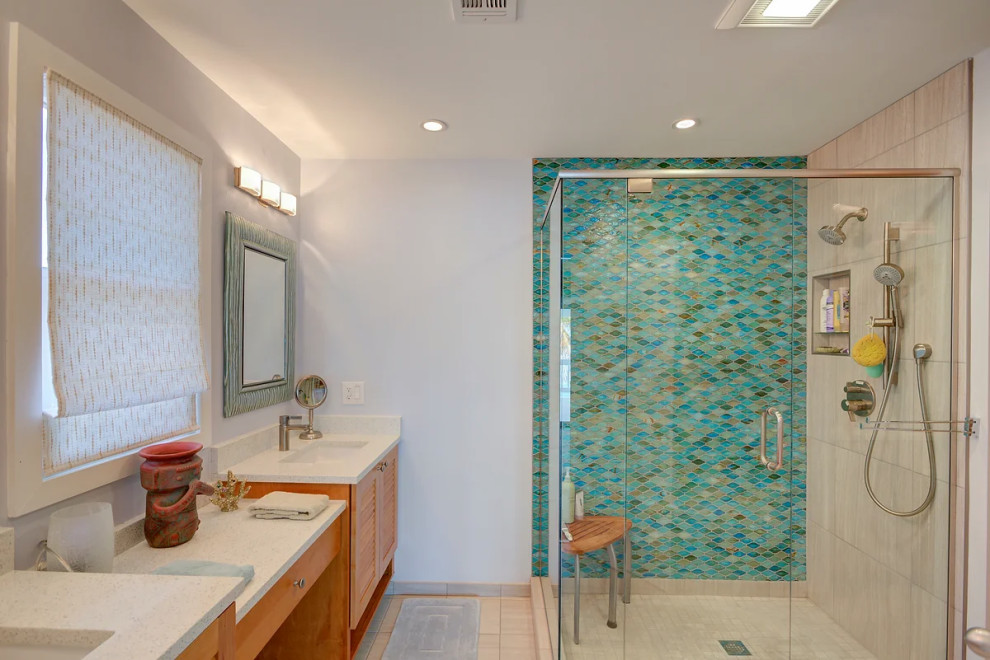 Luxurious Key West bathroom remodel featuring distinctive blue patterned tile work and dual vanity sinks