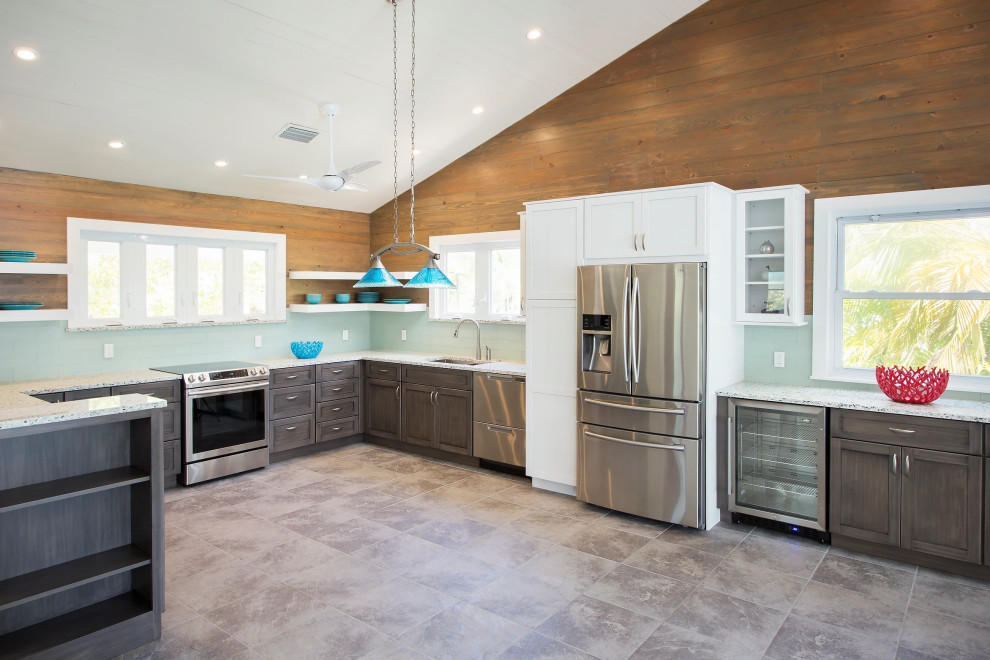 Sleek Key West kitchen remodel featuring professional-grade stainless steel appliances and cabinetry with warm wood accents