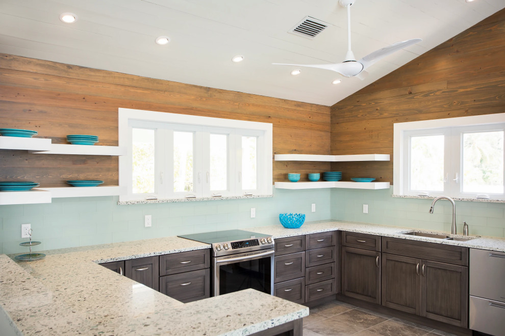 Upscale Key West kitchen renovation with custom wood paneling, floating white shelves, and premium marble countertops