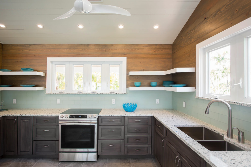 Bright Key West kitchen renovation with custom island sink, premium white cabinetry, and stainless steel appliances