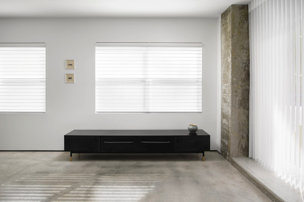 Contemporary primary bedroom with clean lines and natural light in Key West new home construction