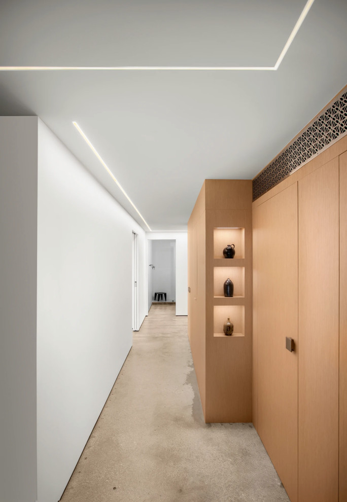 Contemporary entryway with custom lighting and built-in cabinetry in Key West luxury home