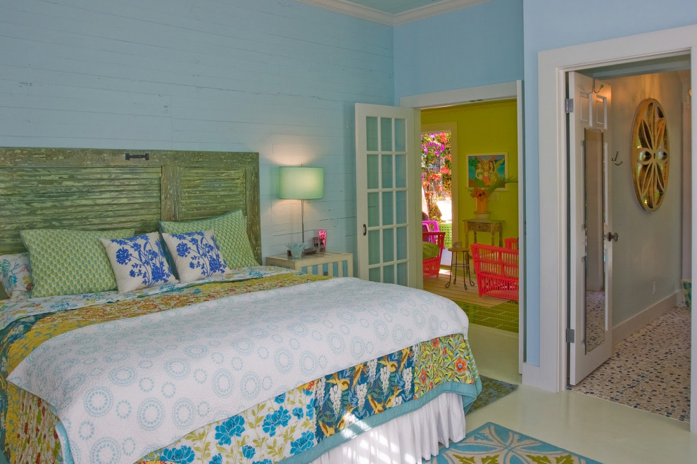 Bright bedroom with decorative metal bed frame and colorful accents in Key West renovation