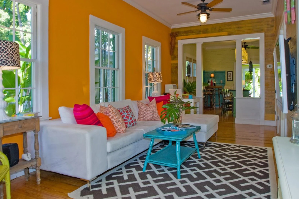 Bright living room with yellow walls and colorful furnishings in Key West renovation