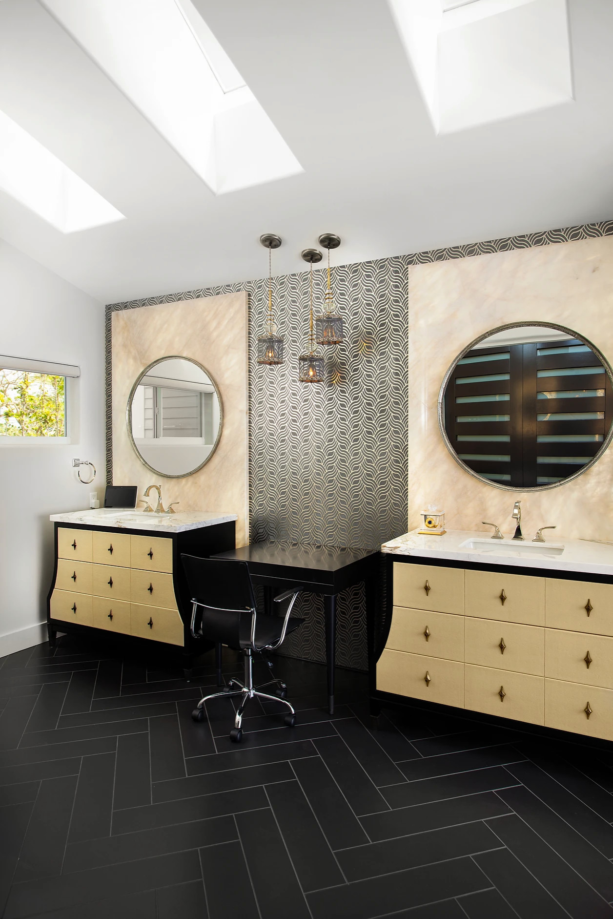 Stylish bathroom renovation with dual mirrors and gold lighting fixtures in Key West retreat