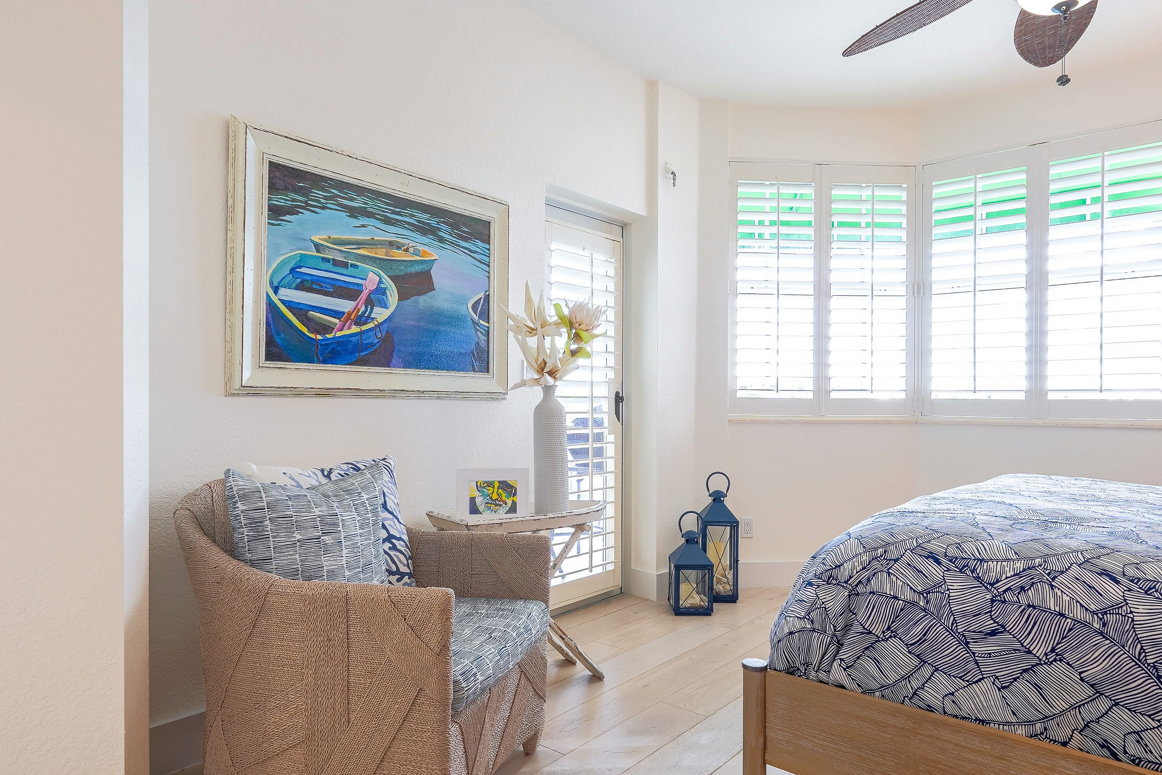 Nautical-themed bedroom with boat artwork and blue accents at Key West Sunset Marina