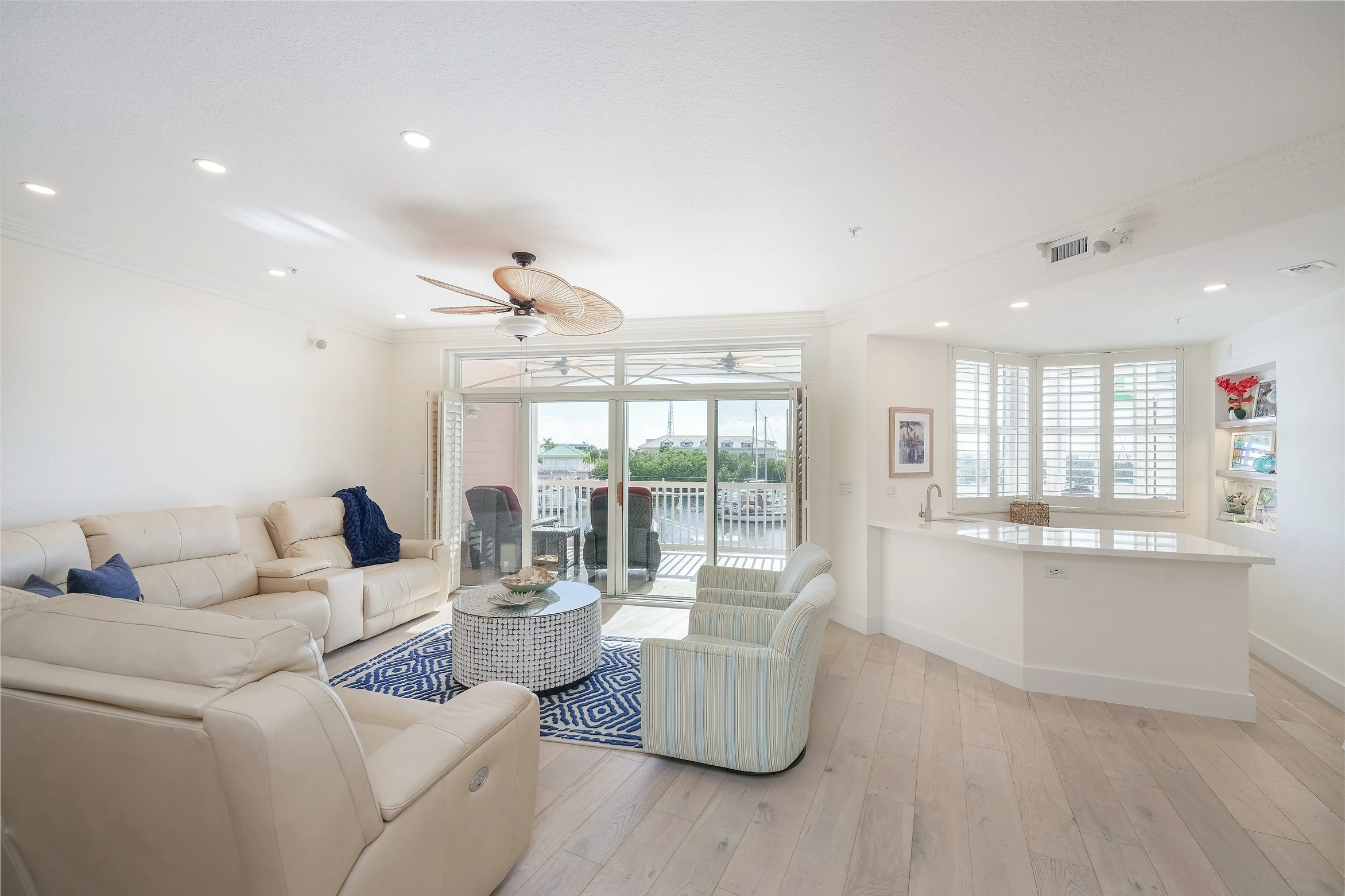 Bright open concept living area with coastal decor at Sunset Marina in Key West